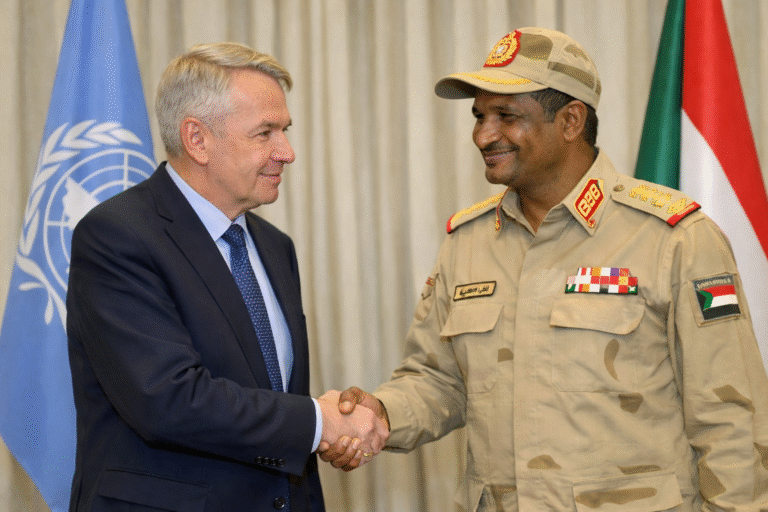 Diplomatic handshake in official setting